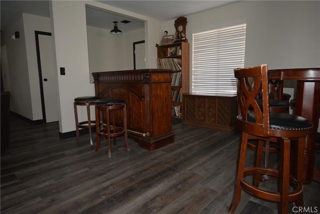 bar featuring dark hardwood / wood-style floors