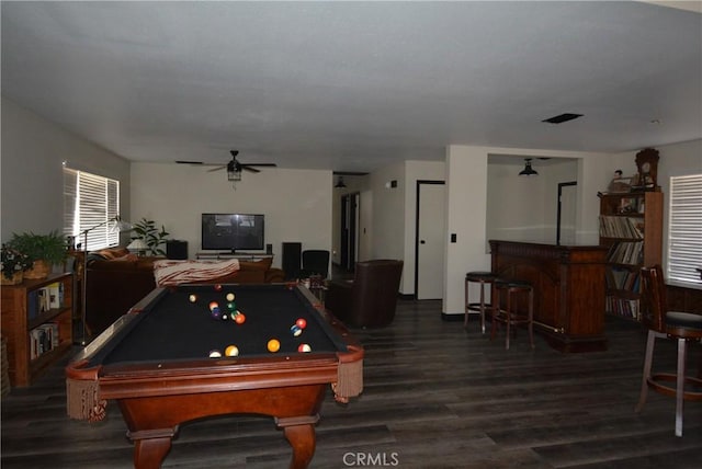 playroom with ceiling fan, dark wood-type flooring, billiards, and bar area