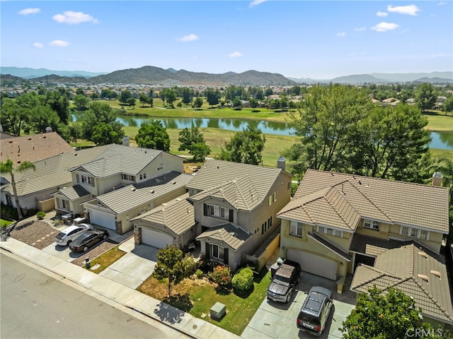 bird's eye view featuring a water and mountain view