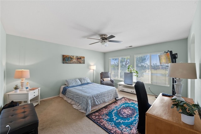 carpeted bedroom with ceiling fan