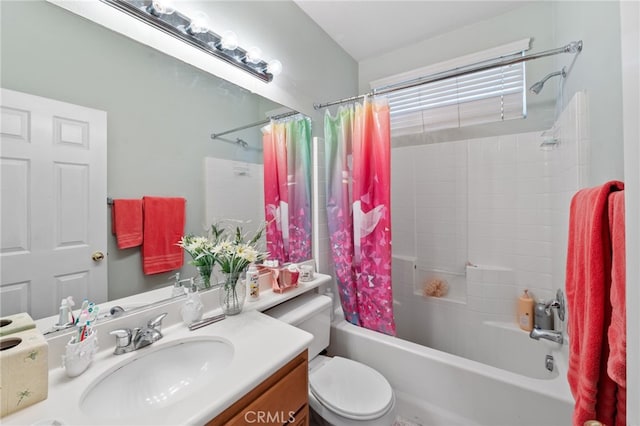 full bathroom featuring shower / bath combination with curtain, vanity, and toilet