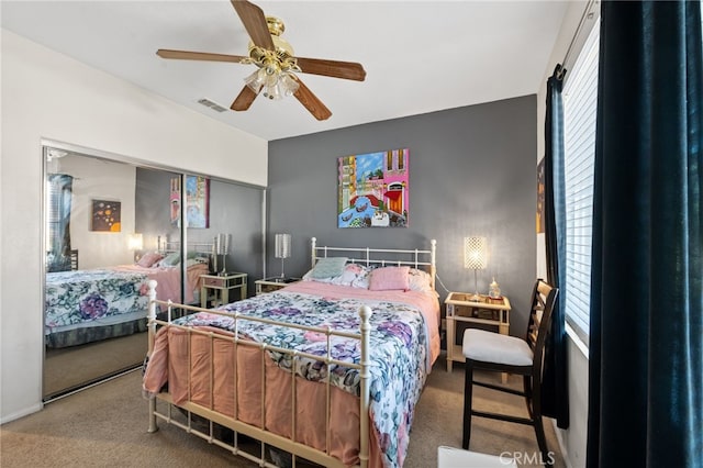 carpeted bedroom featuring ceiling fan