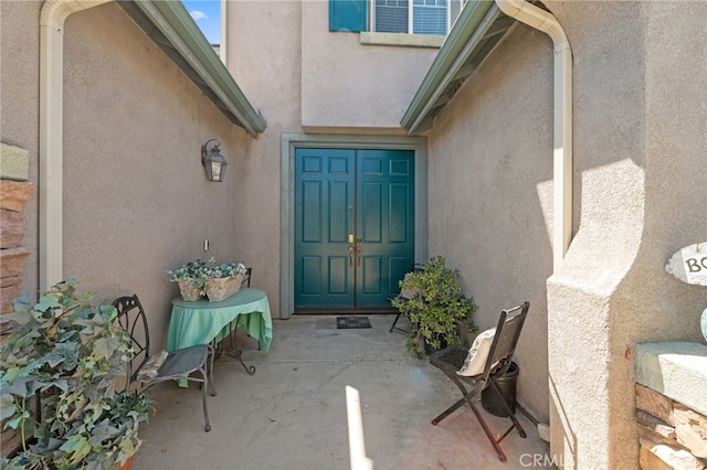 entrance to property with a patio area