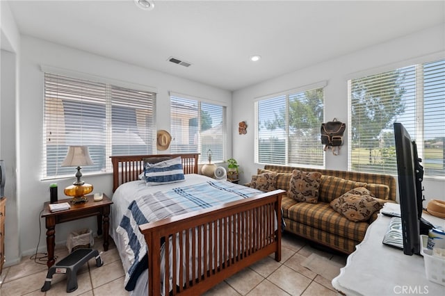 bedroom with light tile patterned floors