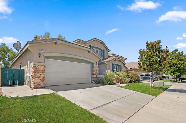 view of front of home featuring a garage and a front yard