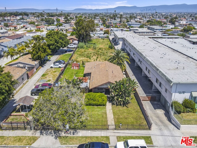 birds eye view of property featuring a mountain view