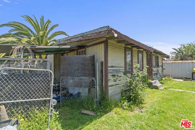 view of home's exterior featuring a lawn