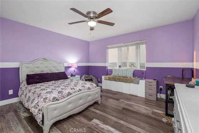 bedroom with dark hardwood / wood-style floors and ceiling fan