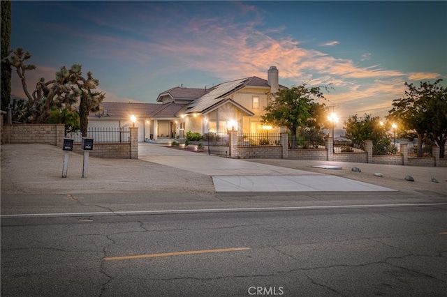 view of front of property with a garage