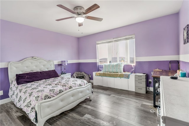 bedroom featuring dark wood-type flooring and ceiling fan