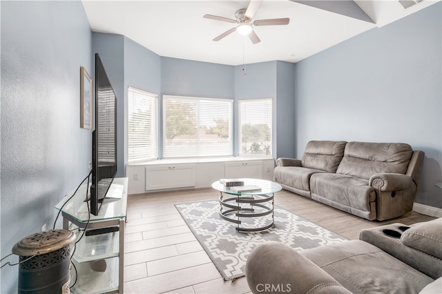 living room featuring light wood-type flooring and ceiling fan