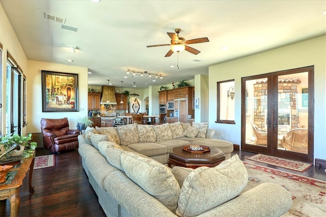 living room featuring french doors, a ceiling fan, dark wood-style floors, and visible vents