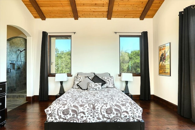 bedroom with dark wood finished floors, multiple windows, lofted ceiling with beams, and wooden ceiling