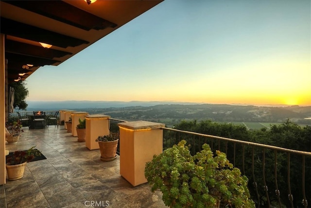 view of balcony at dusk