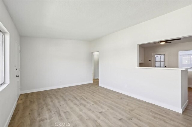 18508 Mansel Ave, Redondo Beach, CA 90278 - unfurnished living room with wood finished floors, baseboards, and a ceiling fan