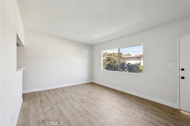 18508 Mansel Ave, Redondo Beach, CA 90278 - empty room featuring wood finished floors and baseboards