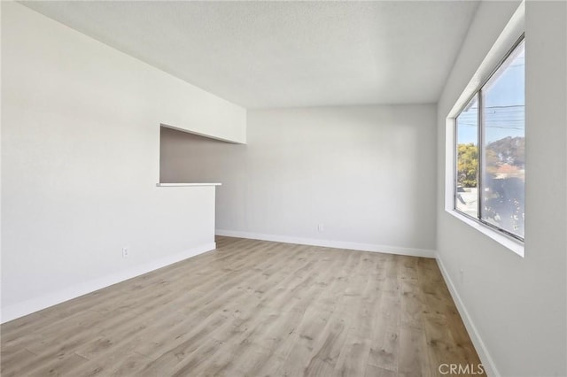 18508 Mansel Ave, Redondo Beach, CA 90278 - unfurnished living room featuring wood finished floors and baseboards