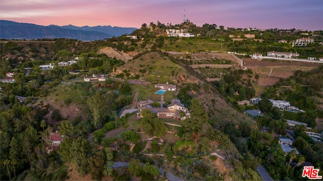 aerial view at dusk with a mountain view