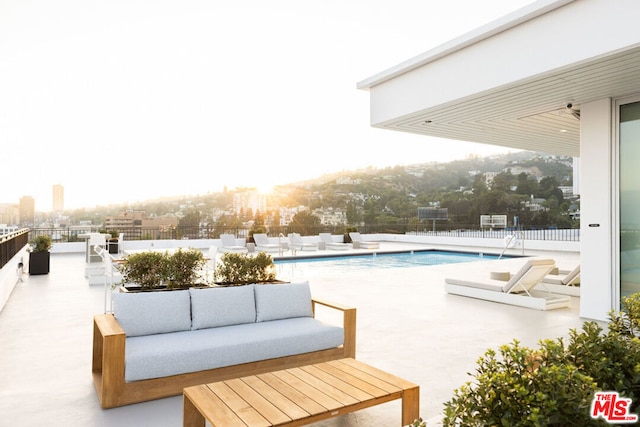 view of pool with a patio and outdoor lounge area