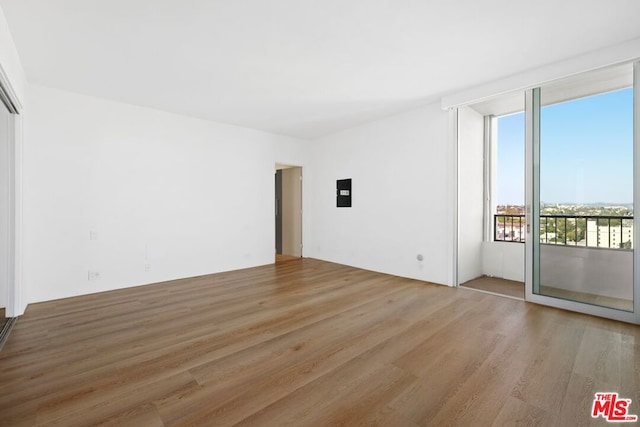 spare room featuring hardwood / wood-style floors