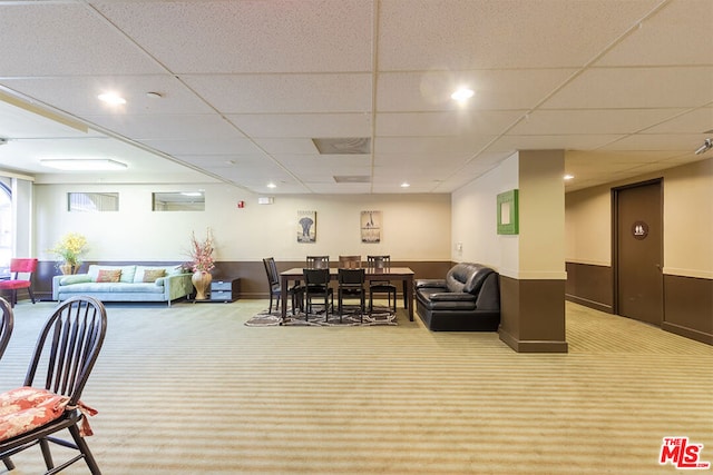 interior space with a paneled ceiling