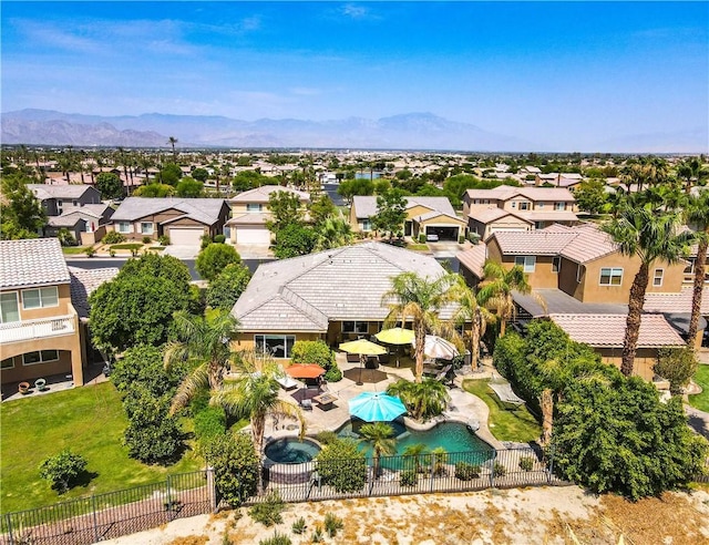 birds eye view of property featuring a mountain view