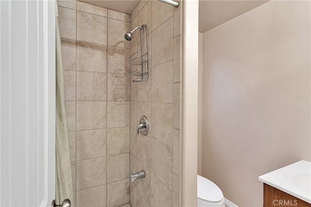 bathroom featuring a shower with curtain, vanity, and toilet