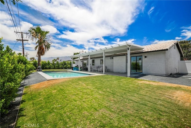 rear view of house with a patio, an outdoor pool, a yard, a pergola, and stucco siding