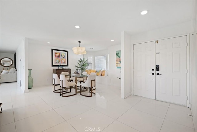 dining area with recessed lighting and light tile patterned floors