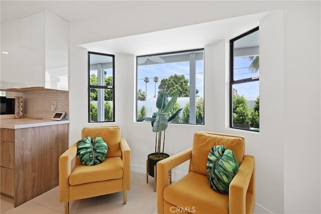 sitting room with light tile patterned floors