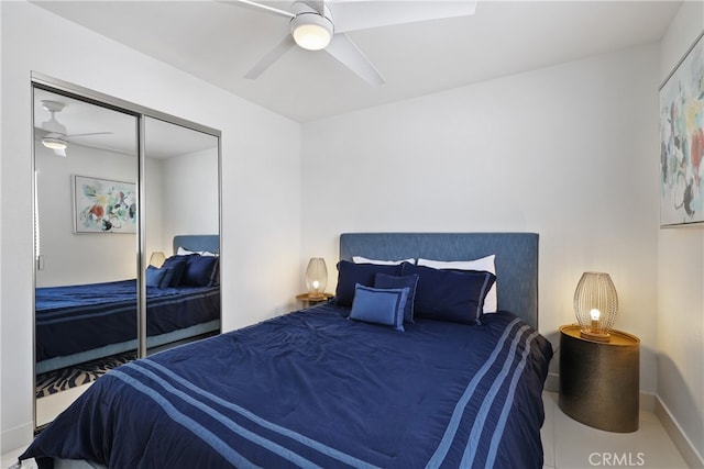 bedroom with ceiling fan and a closet