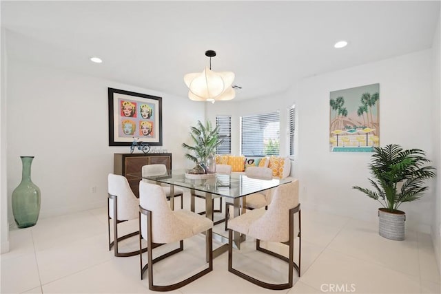 dining room with baseboards, light tile patterned flooring, and recessed lighting