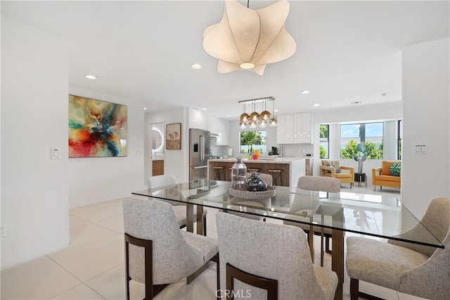 dining room featuring light tile patterned floors and recessed lighting