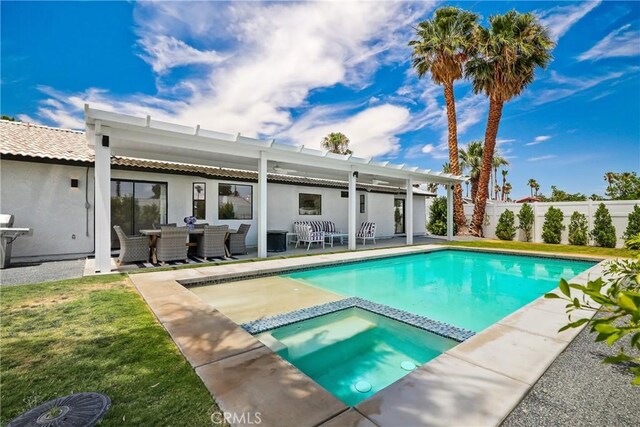 view of swimming pool featuring a patio, an outdoor living space, an in ground hot tub, ceiling fan, and a yard