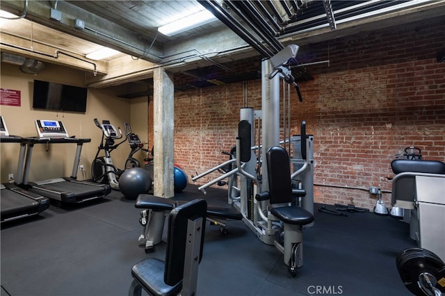 gym with brick wall