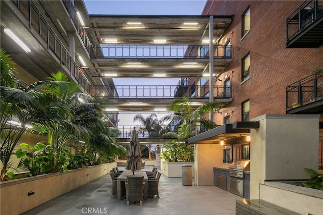 view of patio with area for grilling and exterior kitchen