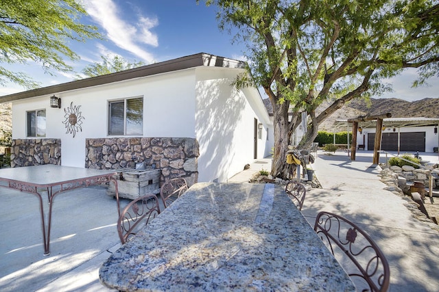 view of side of home featuring a patio