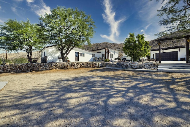 ranch-style home featuring a garage