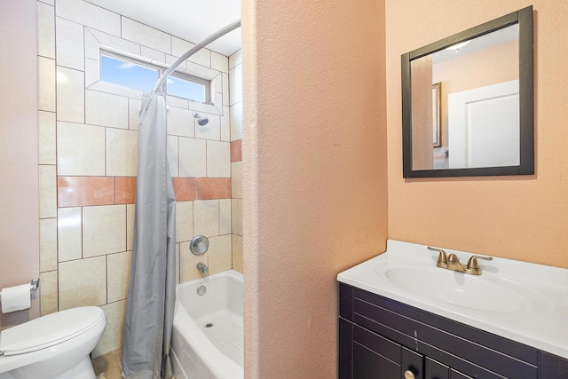 full bathroom with vanity, shower / tub combo, and toilet