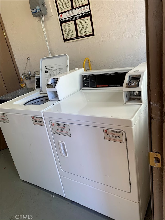 laundry area with washing machine and clothes dryer