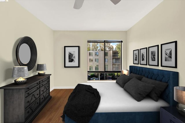 bedroom featuring ceiling fan and dark hardwood / wood-style flooring