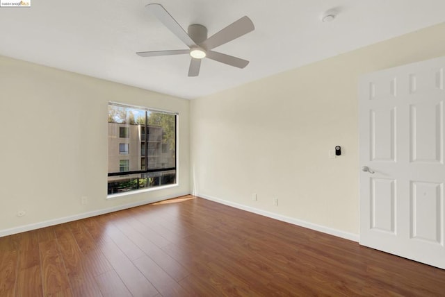 unfurnished room with hardwood / wood-style floors and ceiling fan