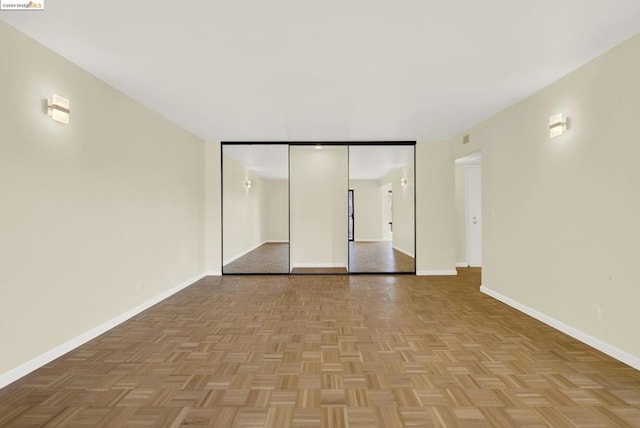 interior space with a closet and light parquet floors