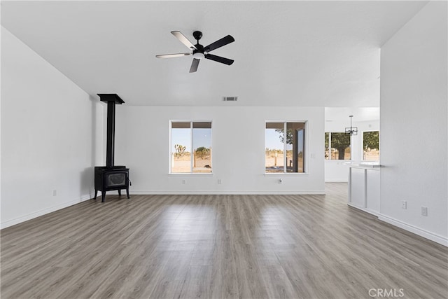 unfurnished living room featuring ceiling fan and hardwood / wood-style floors