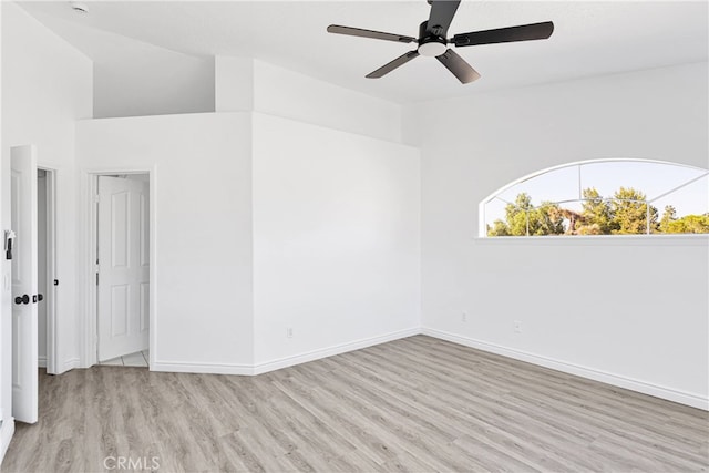 spare room with light hardwood / wood-style floors and ceiling fan