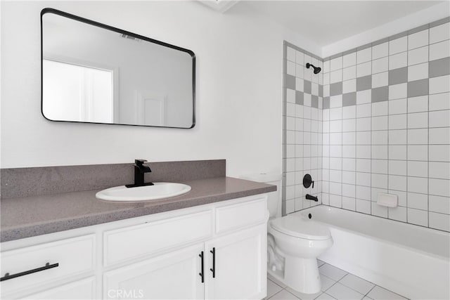 full bathroom with vanity, tiled shower / bath combo, toilet, and tile patterned floors