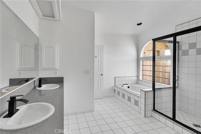 bathroom featuring vanity, tile patterned floors, and shower with separate bathtub