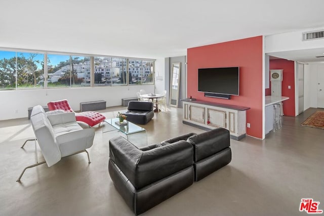 living room featuring concrete floors