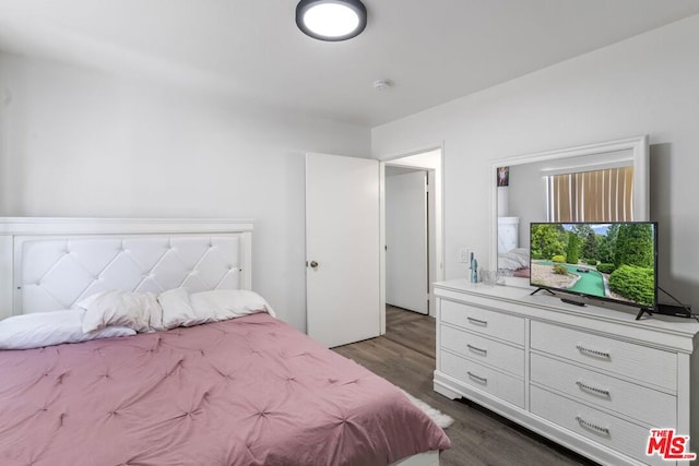 bedroom featuring dark wood-type flooring