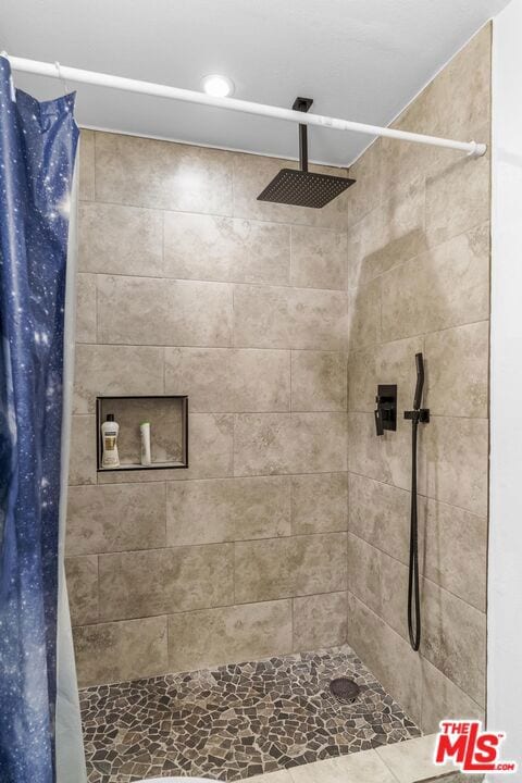 bathroom with curtained shower